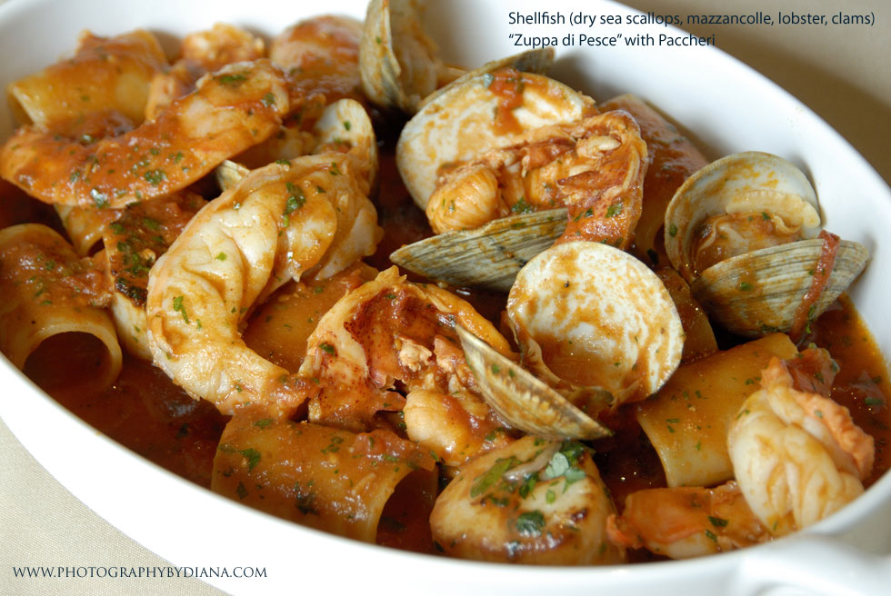 photo of: Shellfish (dry sea scallops, mazzancolle, lobster, clams) Zuppa di Pesce with Paccheri
